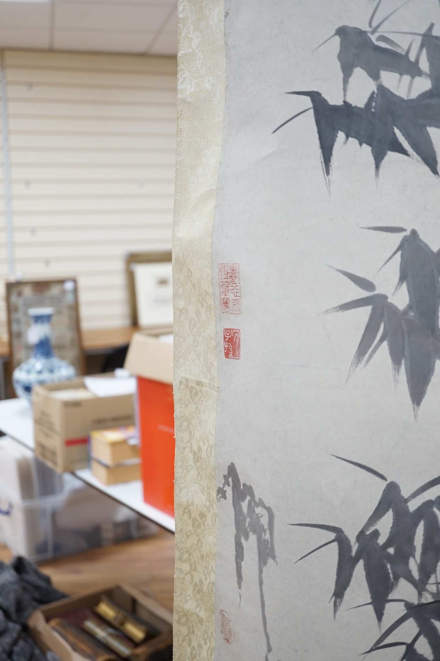 A Chinese printed scroll picture, depicting bamboo groves, 105 x 67cm. Condition - fair